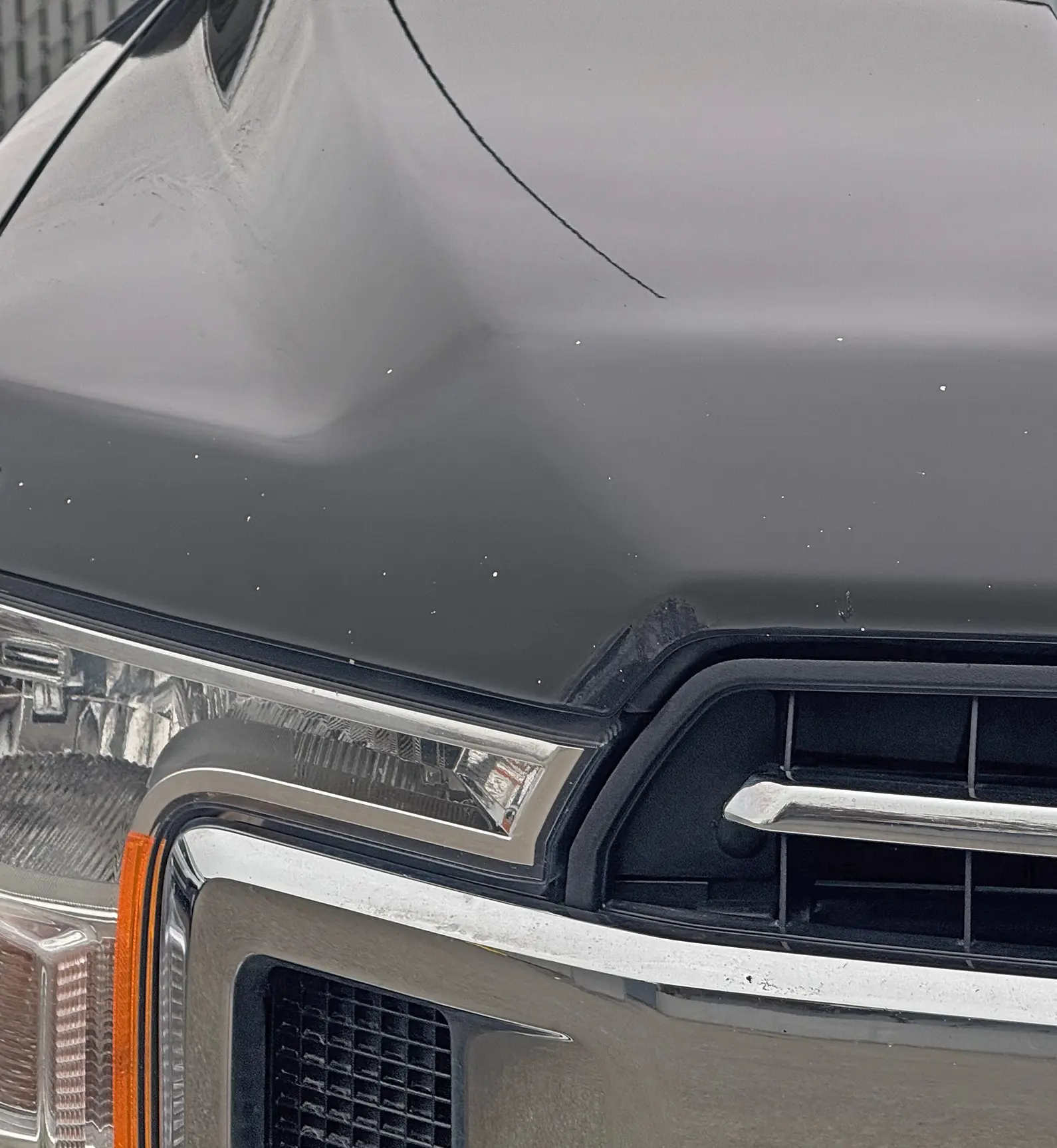 Black truck with chipped paint