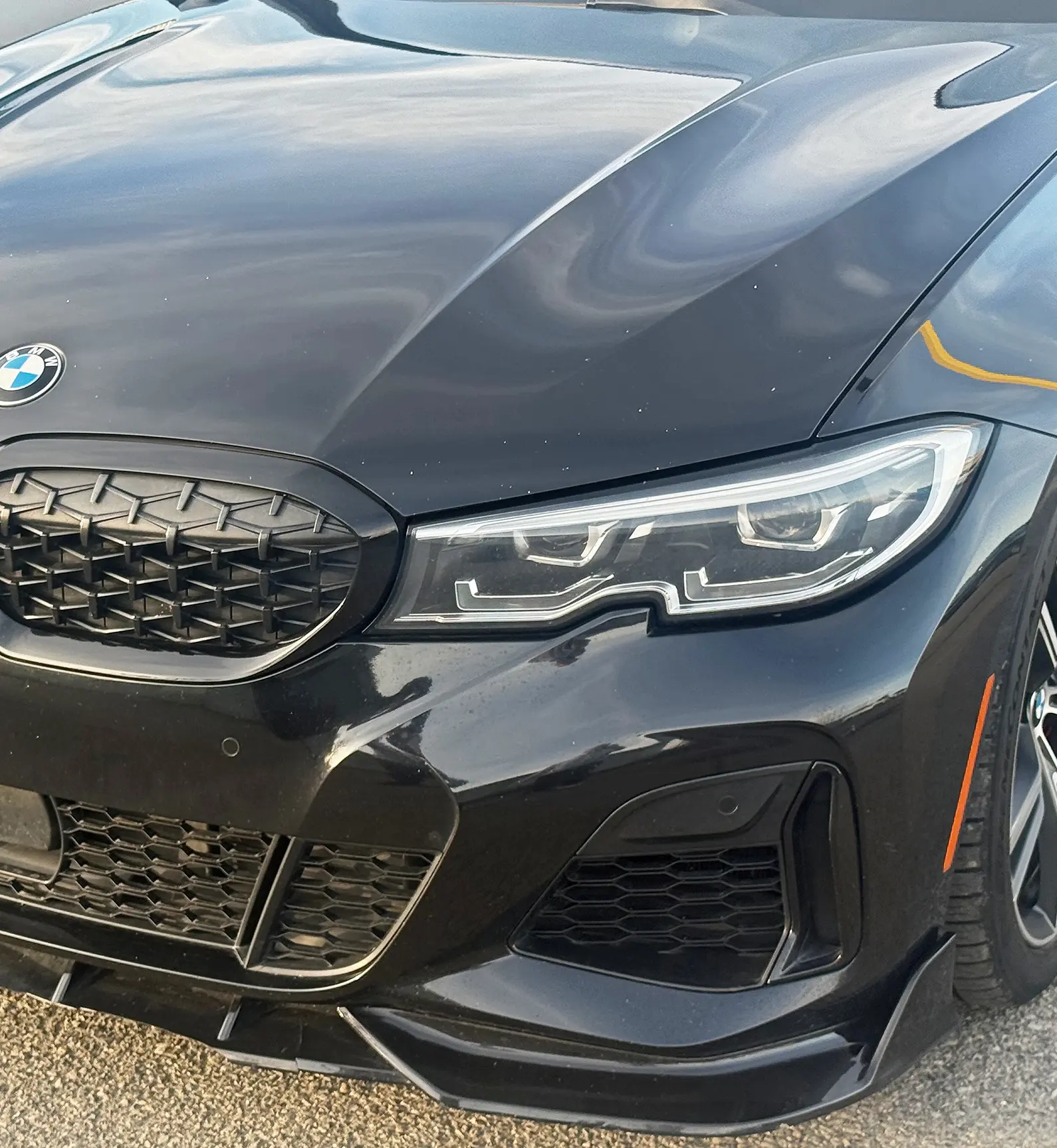 Black BMW with chipped paint
